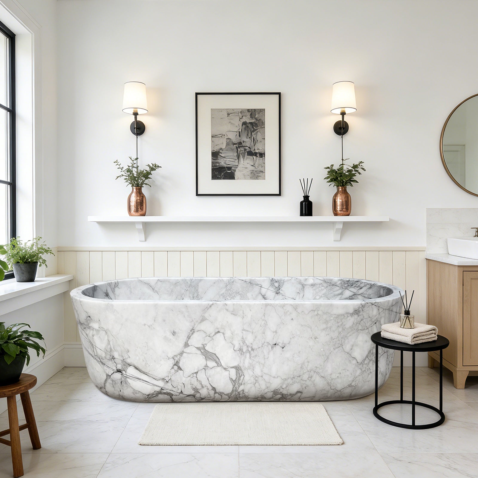 Freestanding white statuario marble bathtub with natural gray veining